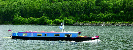 Ocean Princess canal boat built by The Wyvern Shipping Co Ltd crossing Loch Ness, Scotland