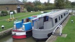 A Wyvern canal boat alongside the new shell of a future boat!